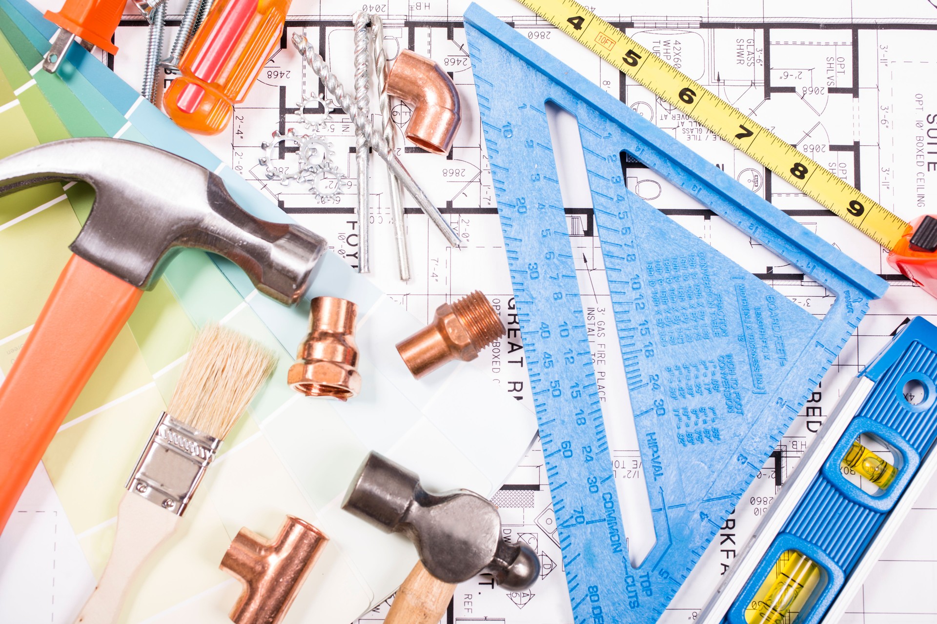 Various constrution, DIY tools lie on home blueprints, plans.