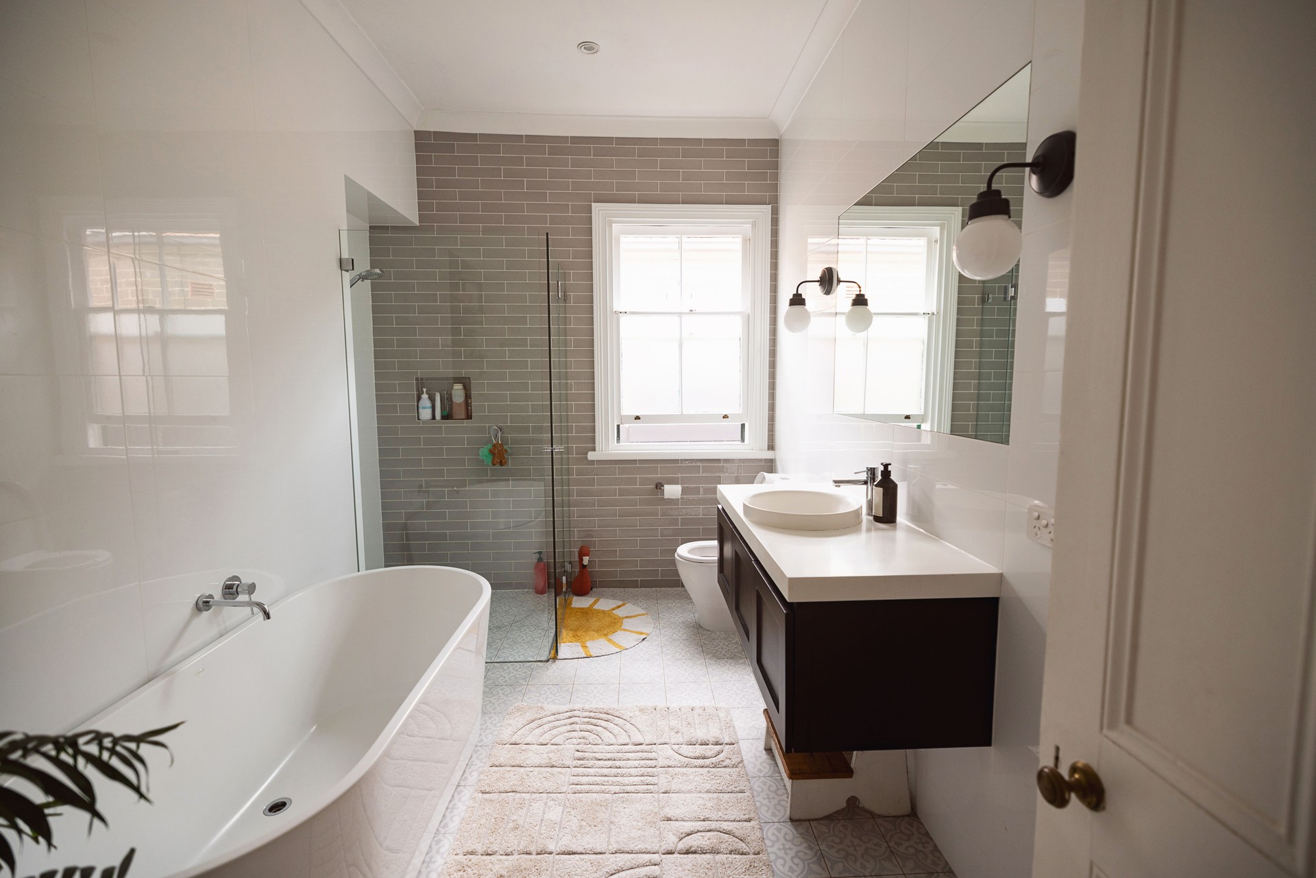 Modern Bathroom Interior With Freestanding Bathtub and Glass-Enclosed Shower